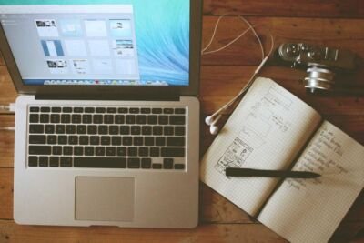 Laptop and notebook with a pen